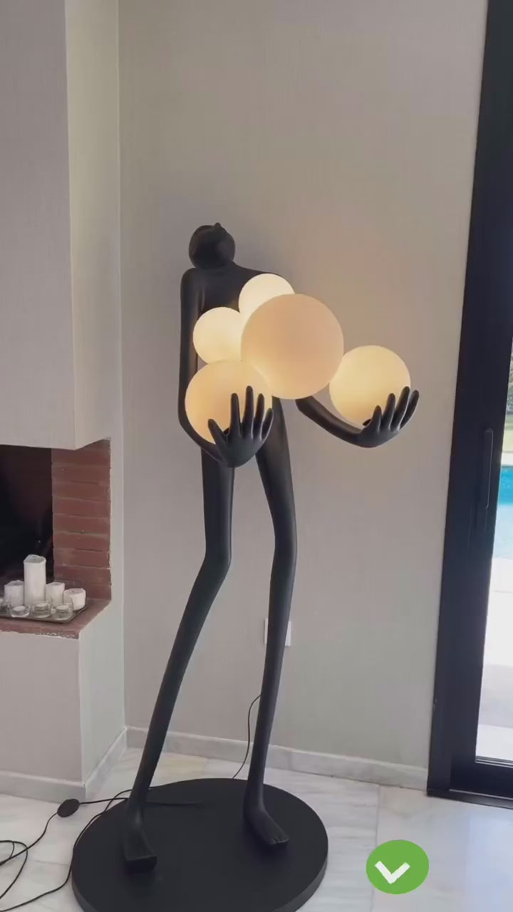 Sculpture Homme aux Six Sphères Lumineuses